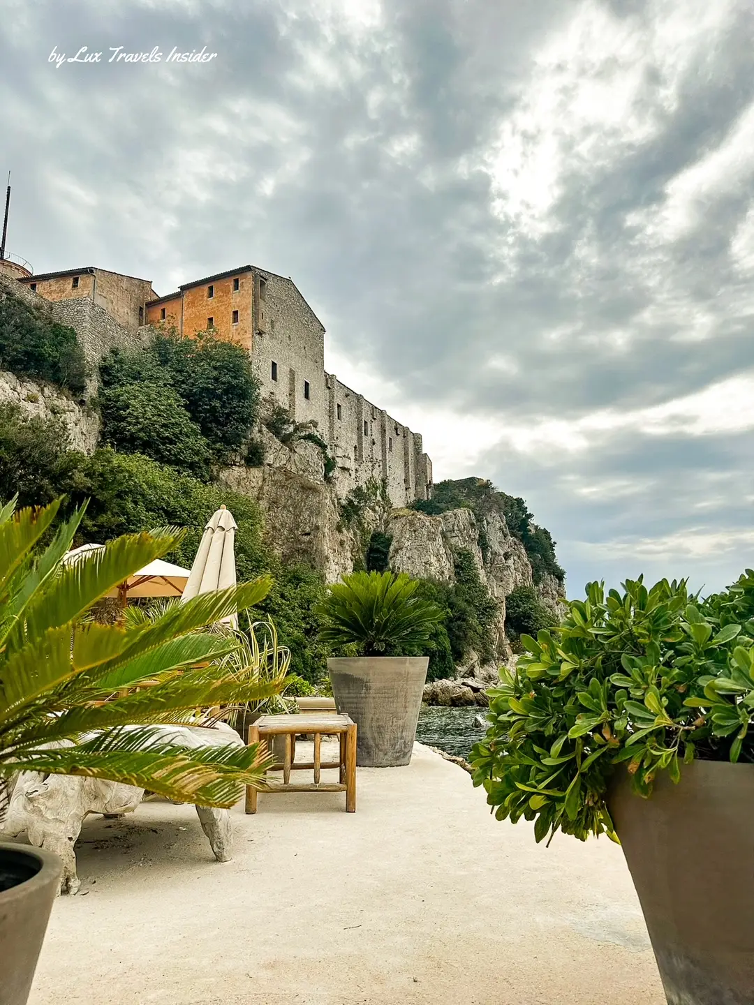 Beach club chairs nestled among lush greenery on the secluded Île Sainte-Marguerite, French Riviera