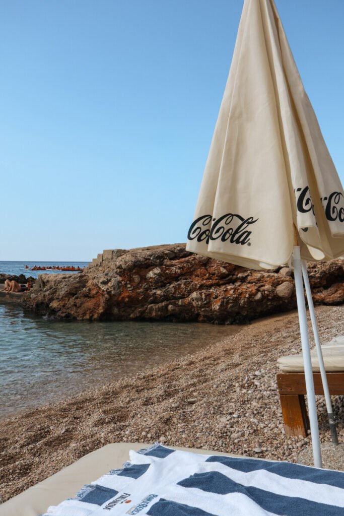 sunbathing in banje beach in dubrovnik croatia